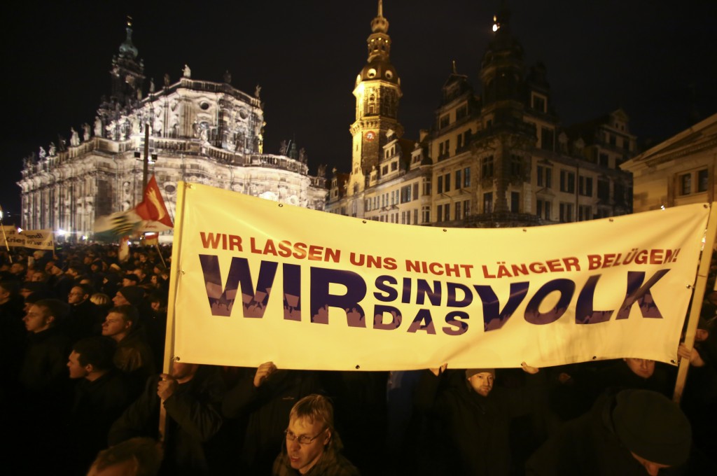 Participants hold a banner during a demonstration called by anti-immigration group PEGIDA, a German abbreviation for "Patriotic Europeans against the Islamization of the West", in Dresden