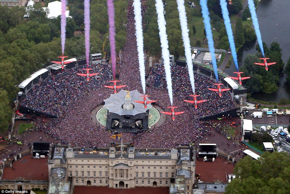 Aerobatic aces: The Red Arrows display team fly in formation over Buckingham Palace